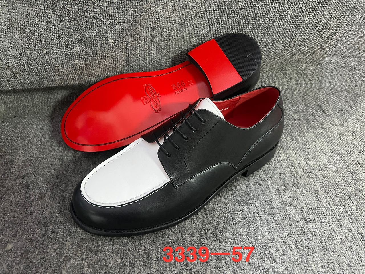 Two tone black and White shoes With a classic lace Up Front and moe Toe design 