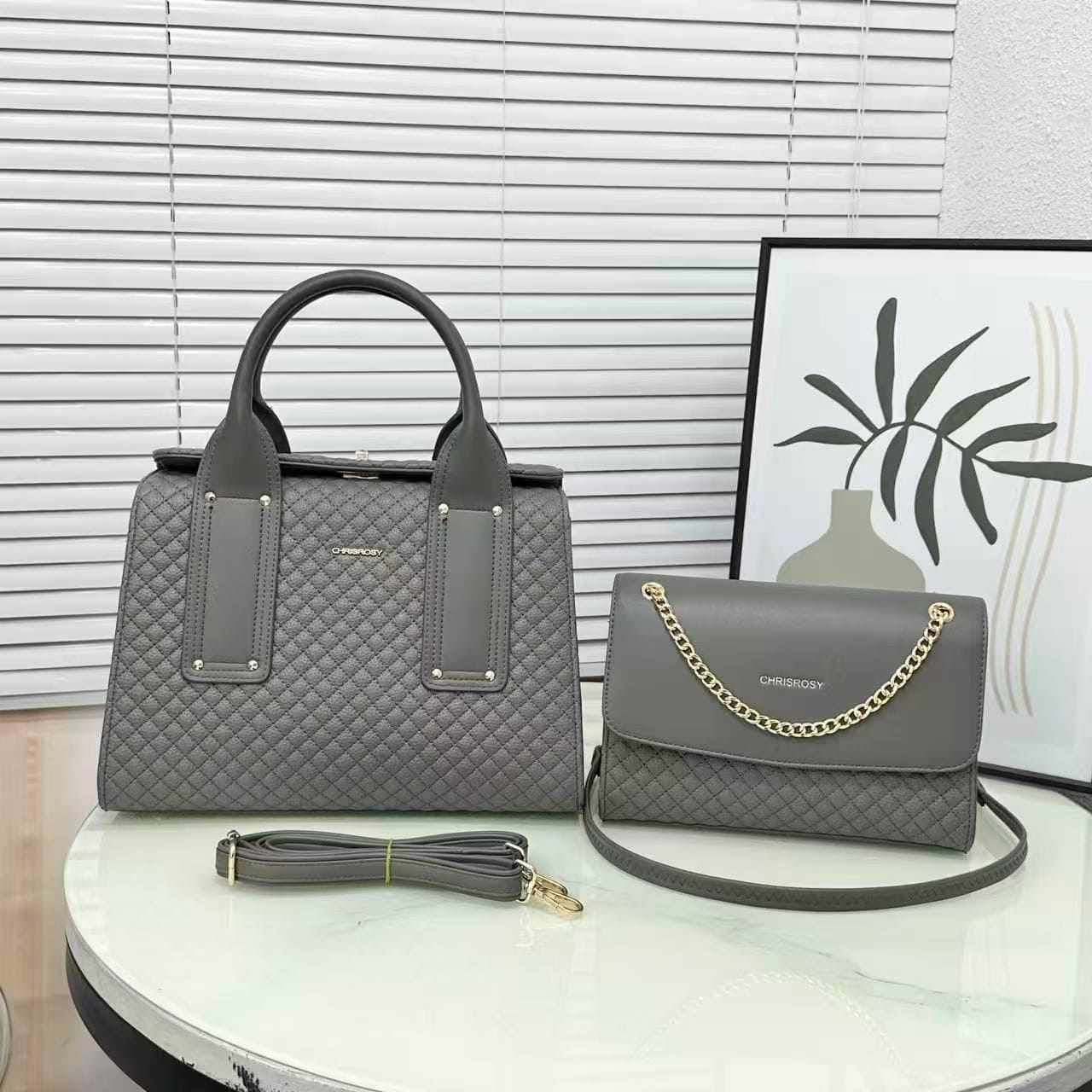 Chrisrosy Quilted Tote Bag and Crossbody Clutch Set is a stylish two-piece grey handbag collection featuring a structured top-handle tote with a diamond-quilted pattern and a matching envelope-style crossbody clutch detailed with a decorative gold chain.