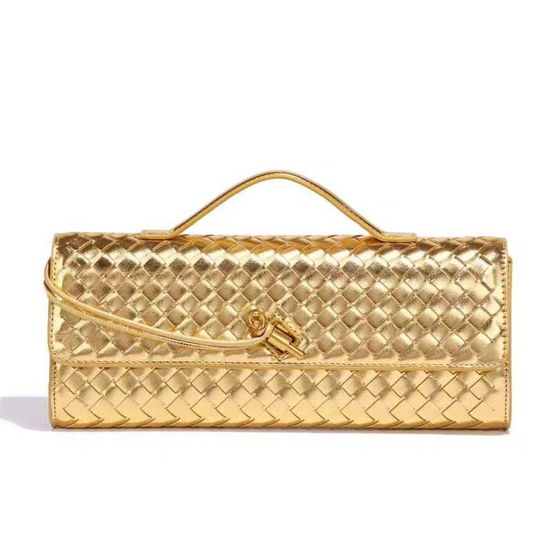 Bottega Veneta Andiamo Long Intrecciato Leather Clutch
​Crafted in Italy from iconic woven leather, this burgundy clutch features a slim top handle and a magnetic flap accented with a signature gold-tone knot. Its leather-lined interior includes card slots and a slip pocket